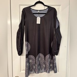 Simple black dress with open slots along sleeves. A-line cut. Small.